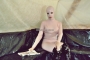 pink-and-black-dolly-in-latex-catsuit-on-pvc-sofa-53