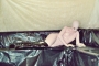 pink-and-black-dolly-in-latex-catsuit-on-pvc-sofa-74