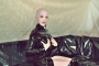 pink-and-black-dolly-in-latex-catsuit-on-pvc-sofa-19