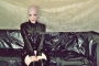 pink-and-black-dolly-in-latex-catsuit-on-pvc-sofa-20