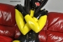 yellow-black-latex-doll-on-leather-sofa-4-06