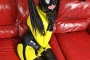 yellow-black-latex-doll-on-leather-sofa-4-24