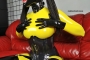 yellow-black-latex-doll-on-leather-sofa-4-40